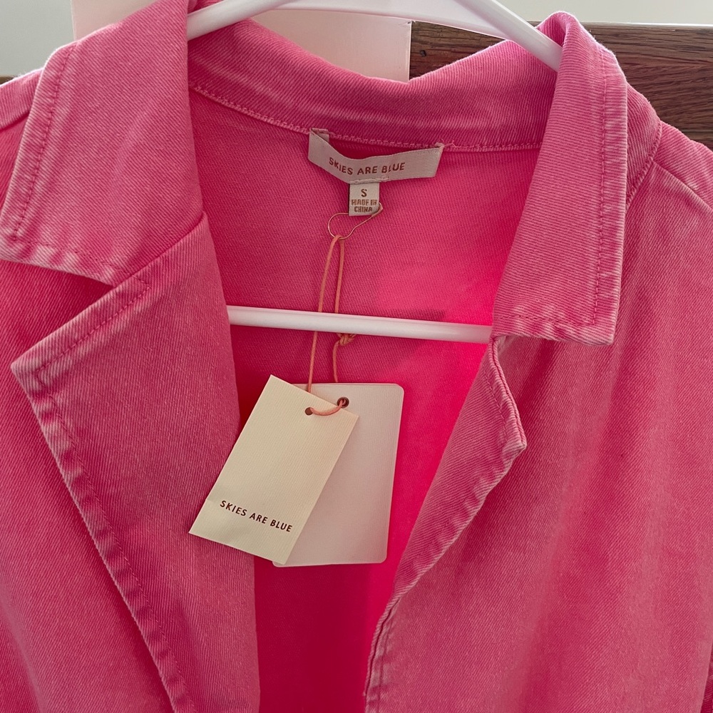 Skies are blue pink denim romper. Size small